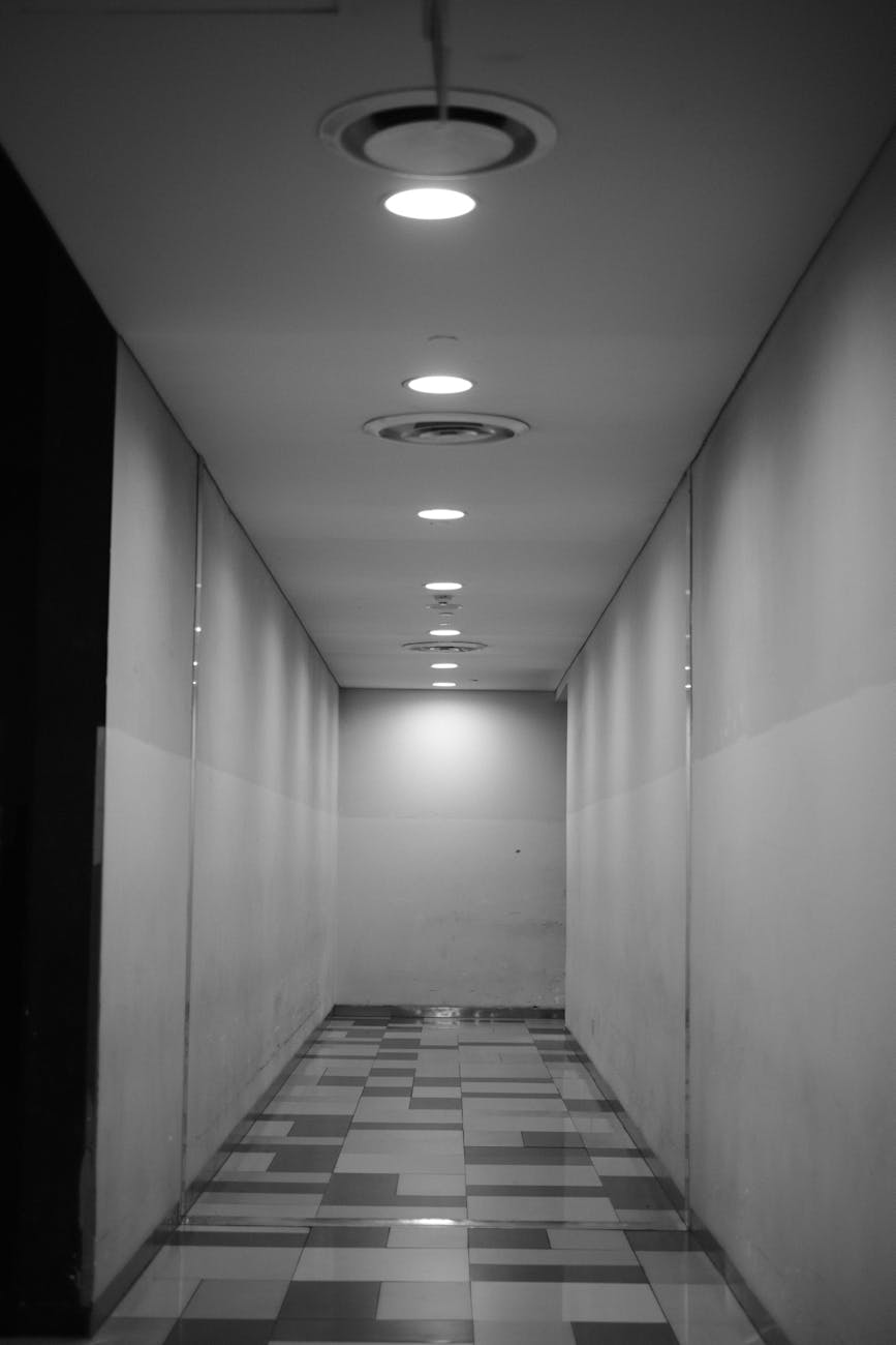 monochrome minimalist indoor hallway with lights